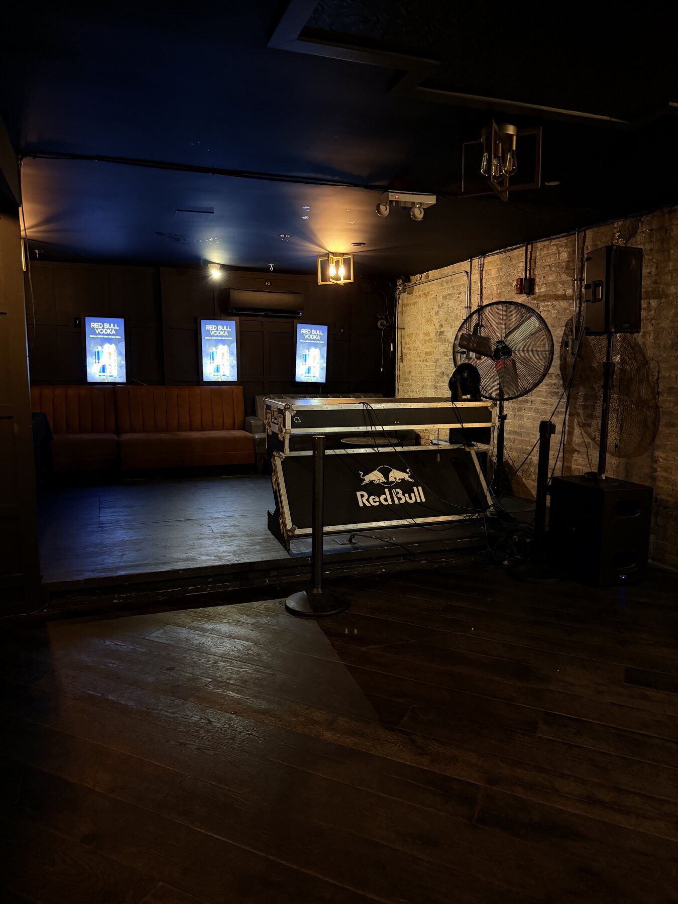 DJ setup and open floor inside Ace of Spades Lounge