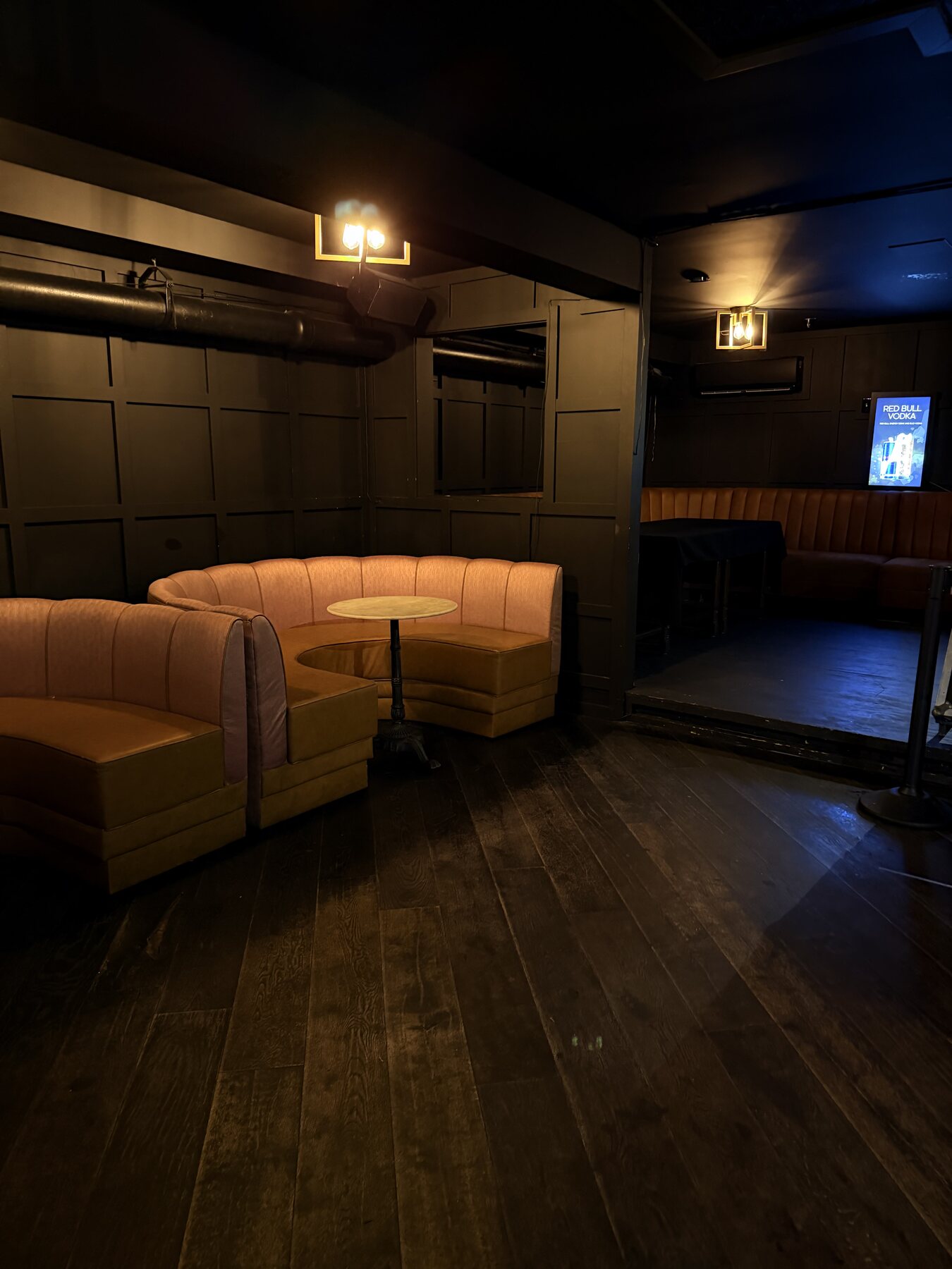 Cream curved banquette in the intimate lounge