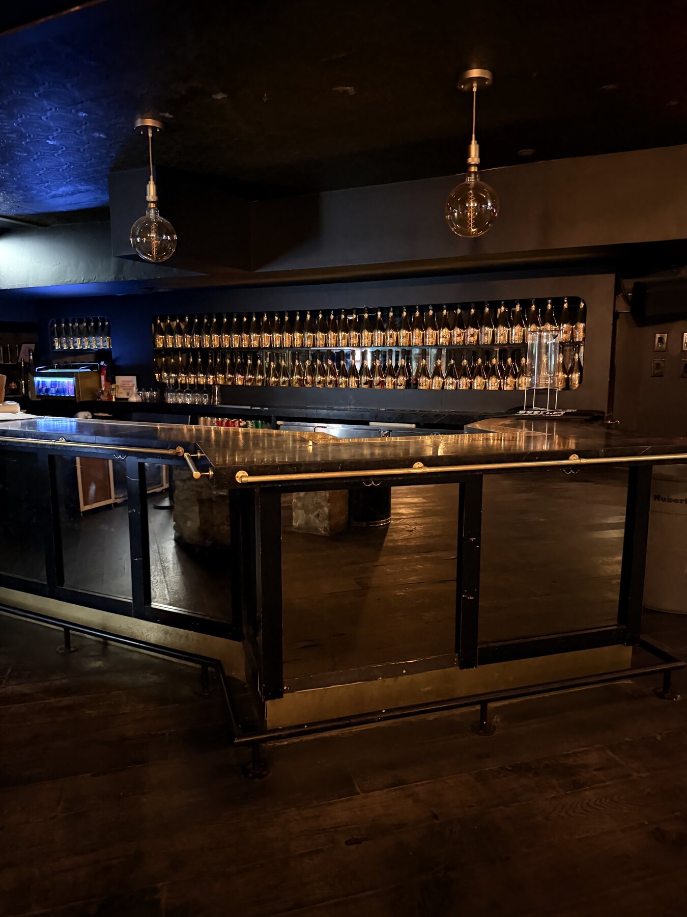 Illuminated bar at Ace of Spades Lounge